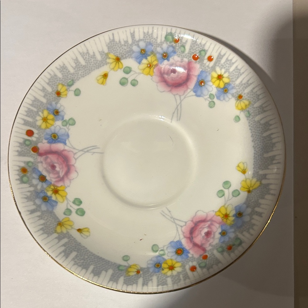 This is a Royal Stafford "Margaret Rose" bone china saucer Vintage